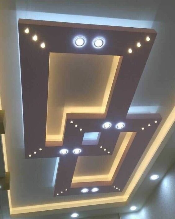 Geometric tray POP ceiling with bronze and gold LED lighting in Kumasi by FreeCoat Decor