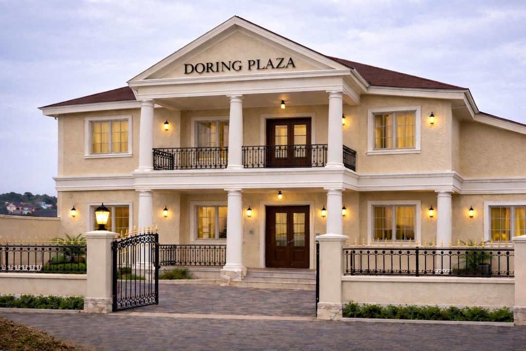 Doring Plaza finished commercial building exterior at dusk in Cape Coast by FreeCoat Decor