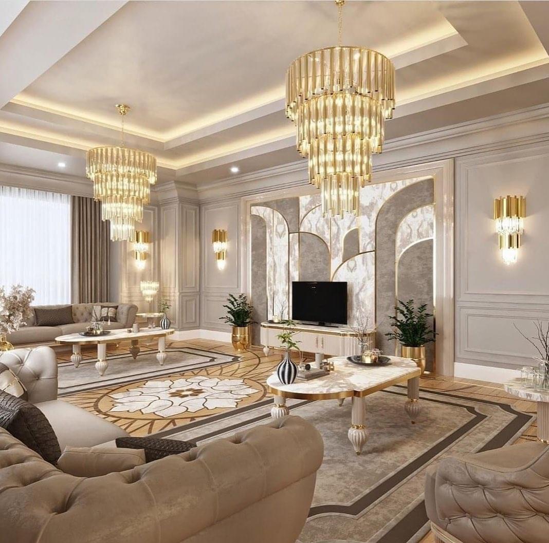 Luxury gold living room with twin chandeliers and marble arch wall by FreeCoat Decor